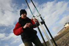 Watching the line tighten in the tide.