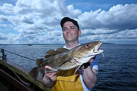 Scotland team member Scott Gibson with cod Scotland team member Scott Gibson with cod